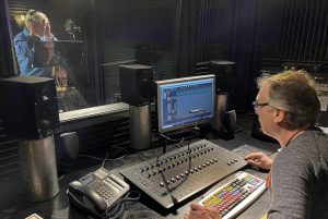 Eric runs the board while Lionel narrates in audio recording studio